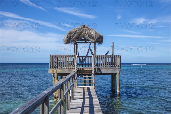 A small wooden house in the Caribbean Sea on Roatan Island. Honduras