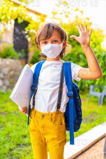 Caucasian child with face mask ready for back to school. New normality