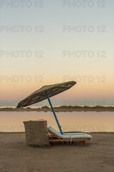 Parasol and sun loungers