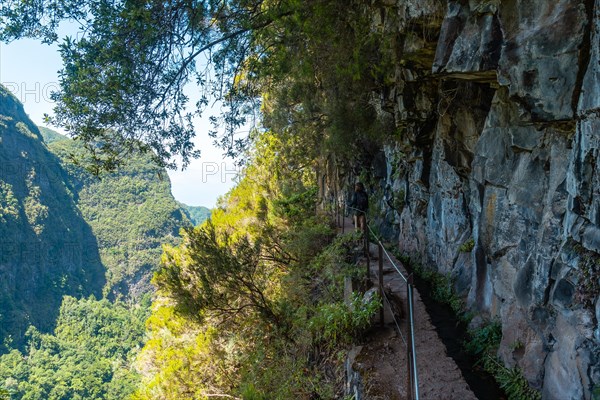 Trekking path next to the waterfall in the Levada do Caldeirao Verde