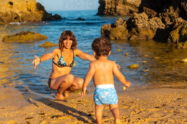 A mother with her son at Praia dos Arrifes