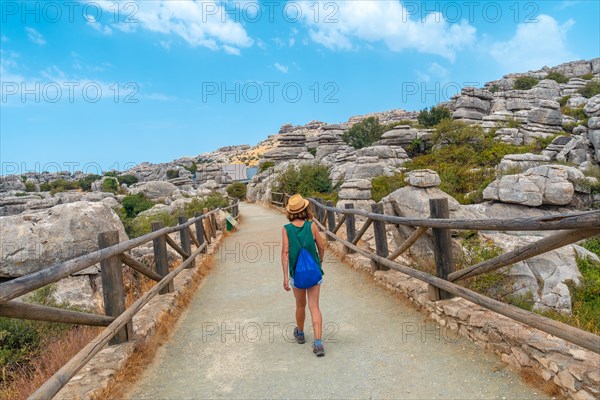 A young woman trekking in the Torcal de Antequera next to the viewpoint