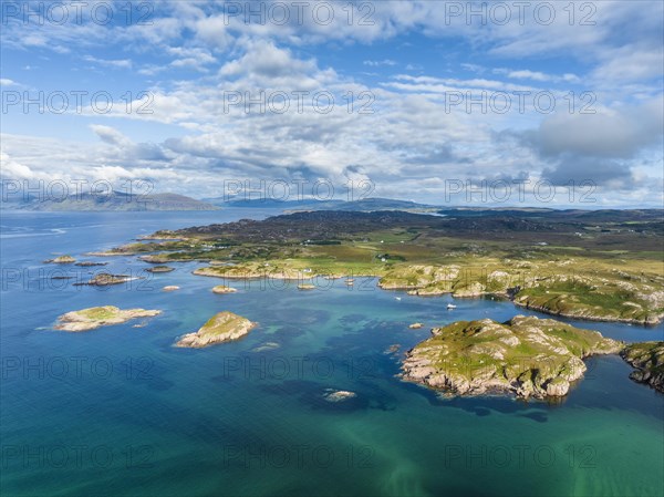 Aerial view of the coastline of the Ross of Mull peninsula with small islands