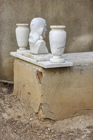 Simple grave with crumbling plaster