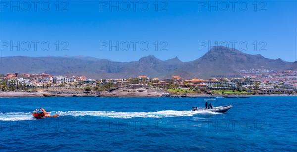 Tourists having fun on a boat on the Costa de Adeje in the south of Tenerife