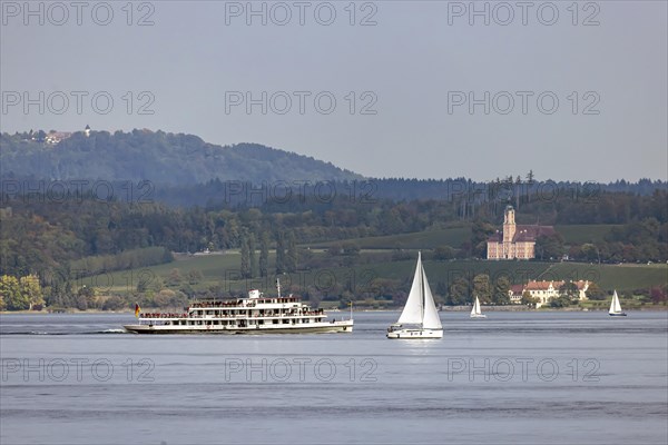 Excursion boat KARLSRUHE underway on Lake Constance against the backdrop of Birnau Monastery