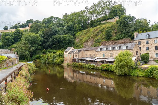 Houses and boats on the Rance river in Dinan medieval village in French Brittany