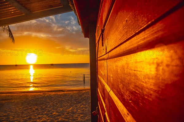 A wooden house at Sunset from West End Beach