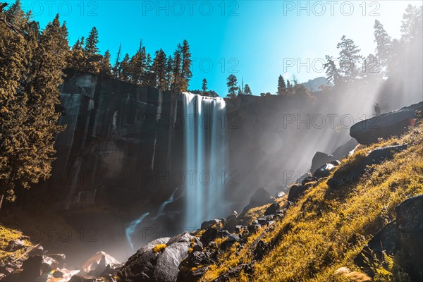 First rays of dawn at Vernal Falls of Yosemite National Park. California