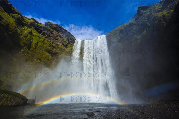 Rainbow at Skogafoss waterfall in the golden circle of south of Iceland