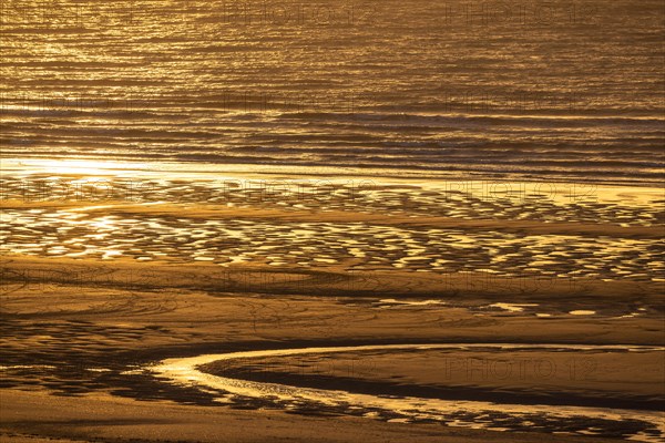 Sunset on the beach of De Panne