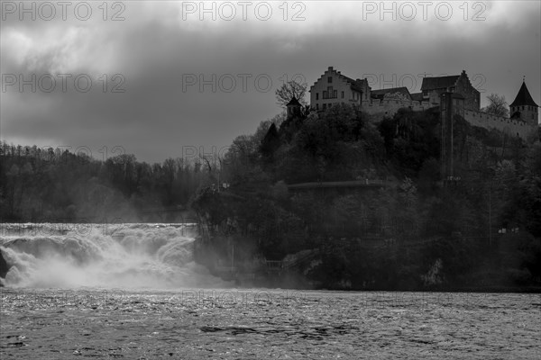 Rhine Falls and Swiss Flag with the Castle Laufen at Neuhausen in Schaffhausen