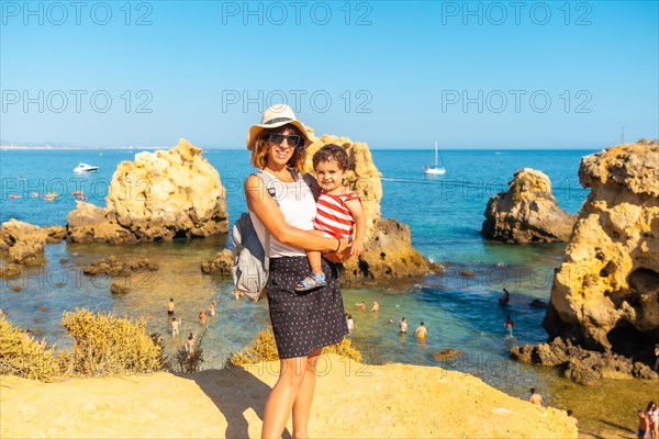 Mother with her son at Praia dos Arrifes