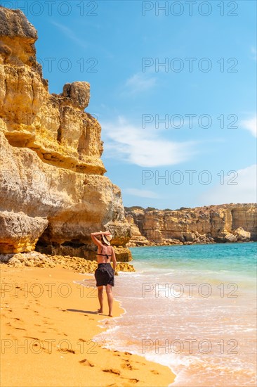 Strolling in summer on vacation on the beach at Praia da Coelha