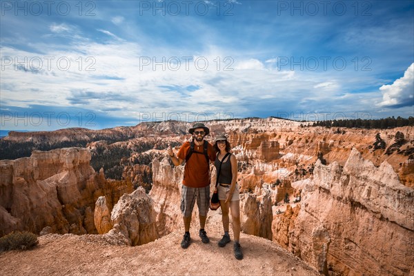 A couple in Beautiful peaks on the trekking Queens Garden Trail in Bryce National Park