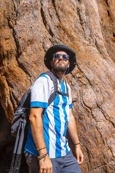 A young man with the texture of a tree bark in Sequoia National Park