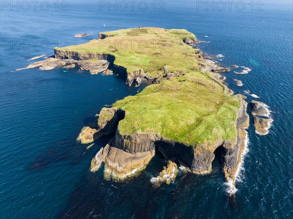 Aerial view of the uninhabited rocky island of Staffa with the prominent basalt columns and Fingal's Cave