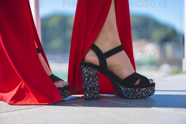 Detail of high-heeled shoes decorated with pearls