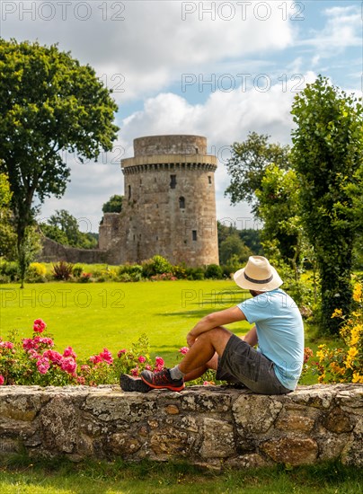 A young tourist visiting the Chateau de la Hunaudaye is a medieval fortress