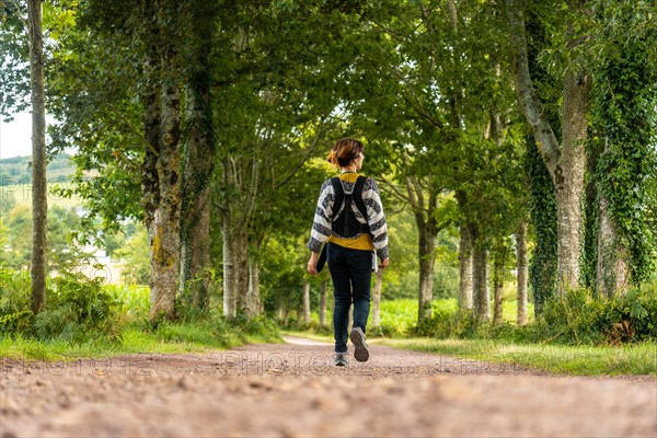 A young mother with her baby in the Broceliande forest