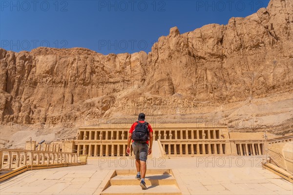 A young woman visiting the Mortuary Temple of Hatshepsut without people on her return from tourism in Luxor after the coronavirua pandemic