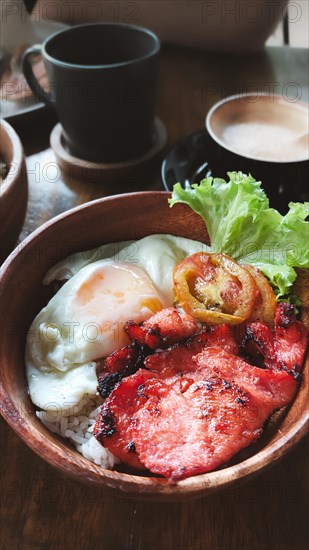 Bowl of tocilog paired with coffee