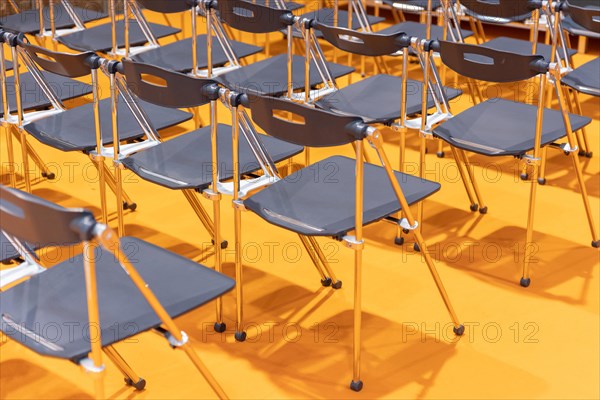 Plastic chairs set up with the row. Mid shot