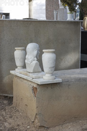 Simple grave with crumbling plaster