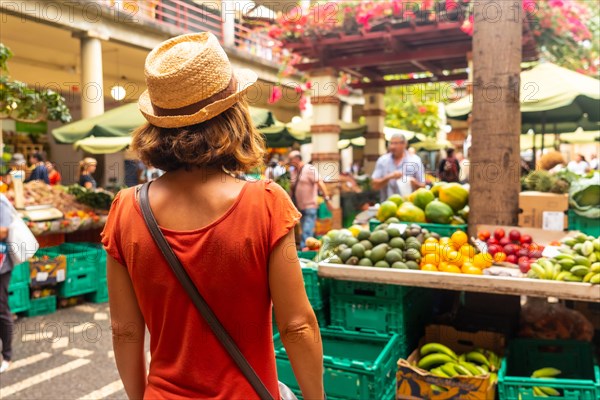 A tourist at the famous Farmers Market in Madeira's city of Funchal. Portugal