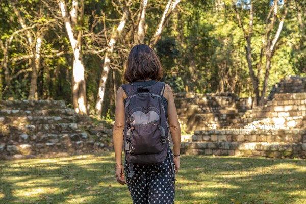 A young woman enjoying the temples of Copan Ruinas. Honduras