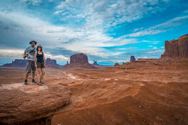 A young couple of Europeans at John Ford's Point in Monument Valley. Utah