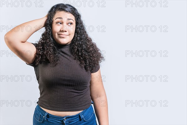 Young woman scratching her head with doubtful expression. People scratching heads with indecisive expression isolated