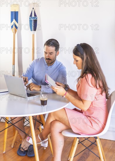 A couple teleworking at home