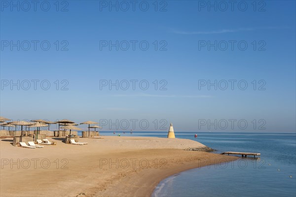 Parasol and sun loungers