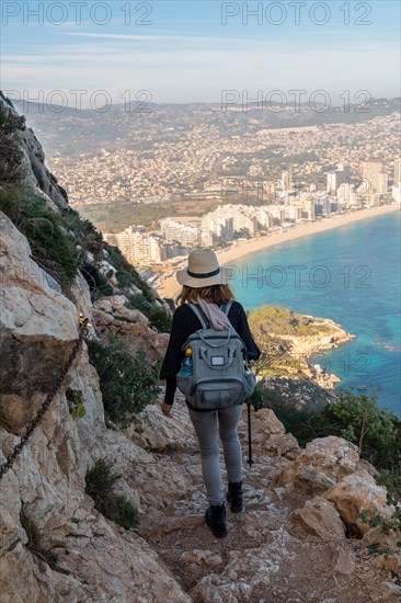 A young hiker wearing a hat