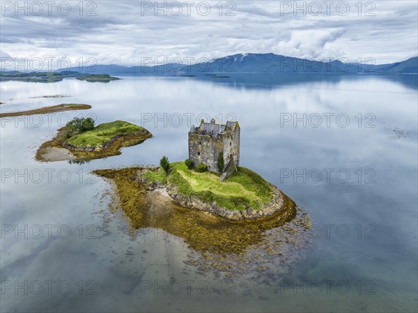 Aerial view of the 14th century island castle Castle Stalker in Loch Laich
