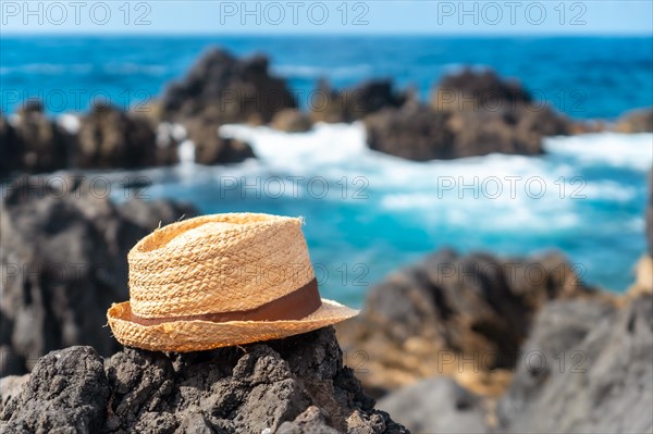 Hat next to a natural pool in summer