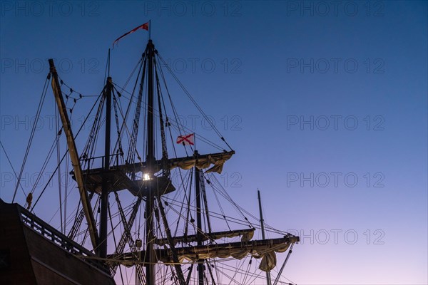 Detail of the old ship at sunset on the promenade of Muelle Uno in the Malagaport of the city of Malaga