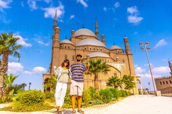 A couple of European tourists visit the Alabaster Mosque in the city of Cairo