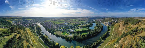 The river loop near Homburg am Main winds through the valley and is surrounded by trees and vineyards. Homburg