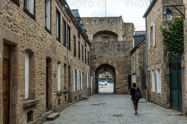 Lovely wooden houses in the old town of Dinan and its medieval castle along the Rance river in French Brittany