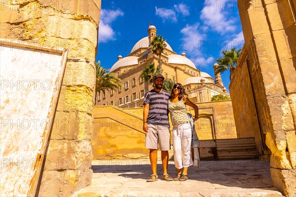 A couple of tourists enjoying the visit to the Alabaster Mosque in the city of Cairo