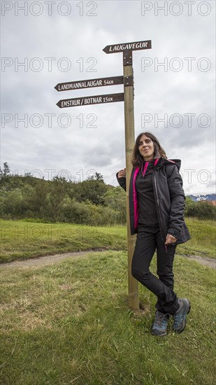A young woman at the 54 km Thorsmoerk signal of the 4-day trek to Landmannalaugar. Iceland