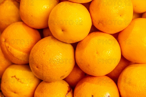 Orange fruit at the Farmers Market in the Madeira city of Funchal. Portugal