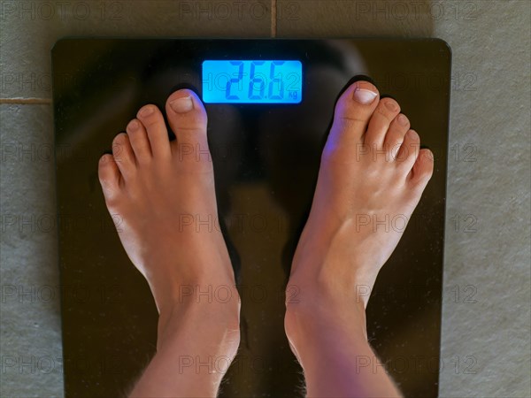 Children's feet on personal scale