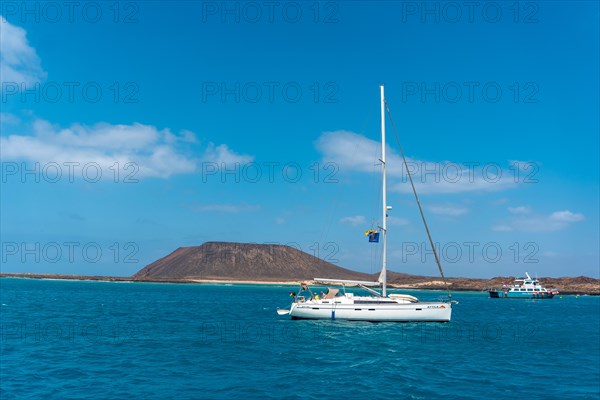 Boats in turquoise water on Isla de Lobos