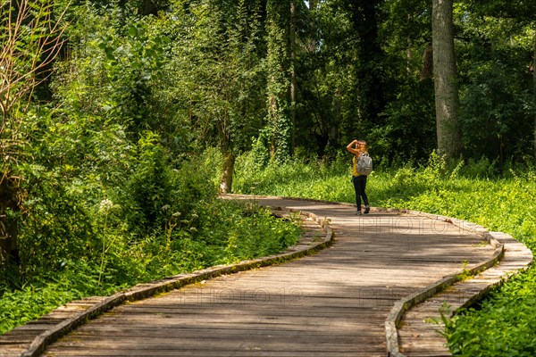 A young woman walking on the trek on the trail between La Garette and Coulon