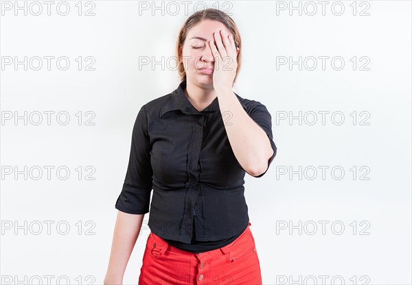 Exhausted woman with palm on forehead isolated. Tired and exhausted young girl holding her forehead. Worried young woman holding his forehead