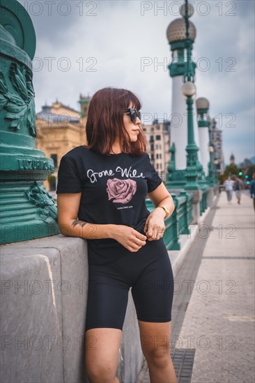 Lifestyle in the city. A young brunette with sunglasses