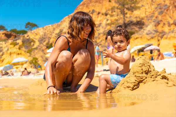 Playing in the sand with the son